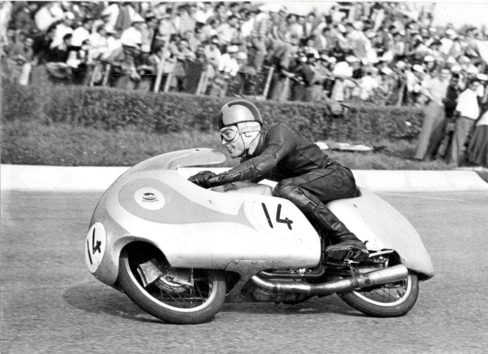 Sammy Miller racing a dustbin-faired Mondial 250 Bialbero, number 14, at Monza in 1957
