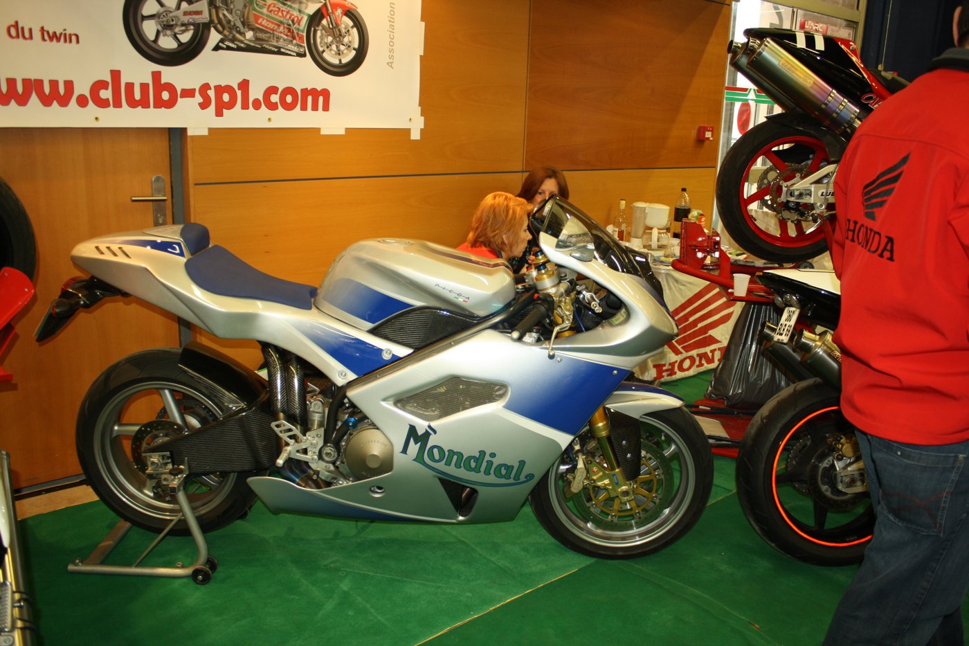 Silver and blue Mondial Piega 1000 superbike with Mondial script on its fairing