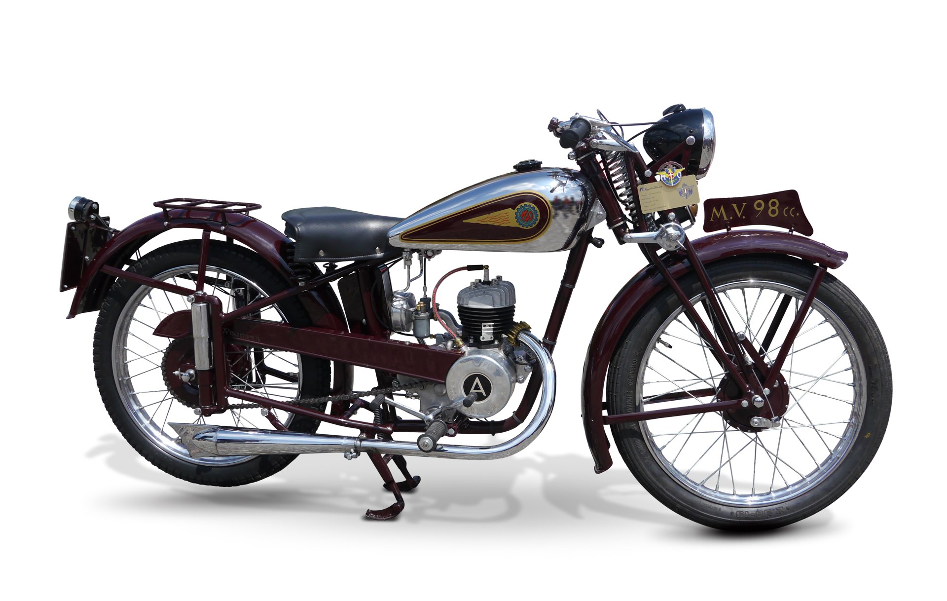 A restored MV Agusta 98 with maroon frame, chrome tank and girder forks, photographed against a white background