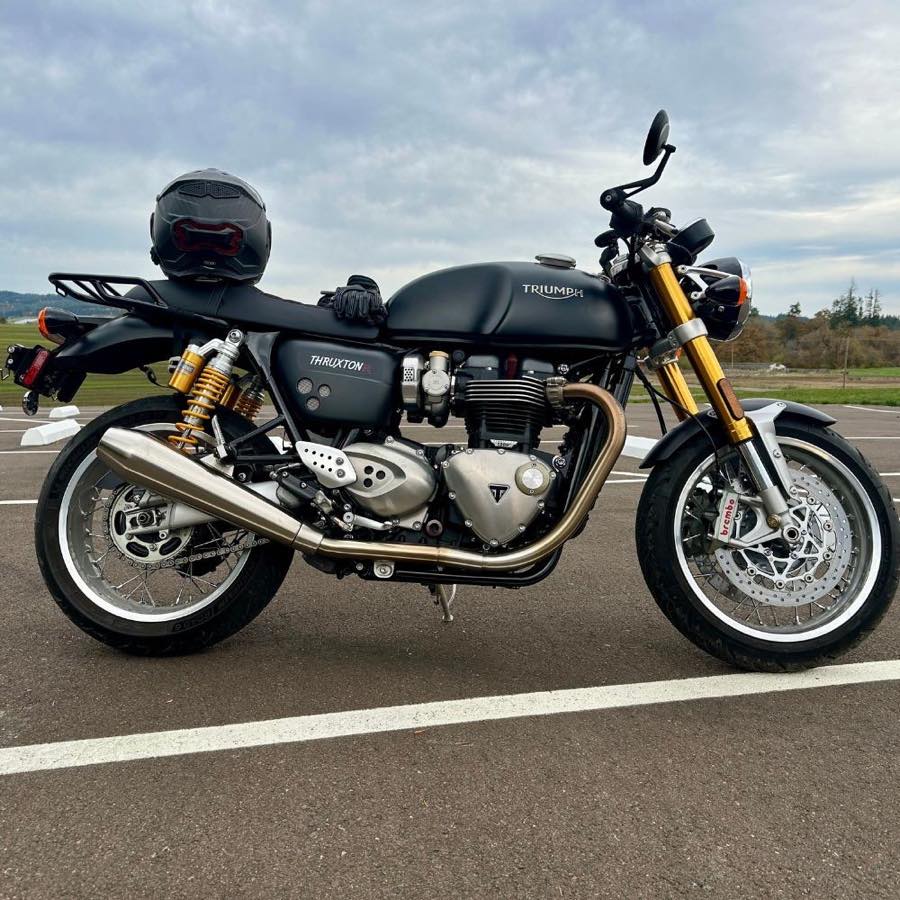 2017 Triumph Thruxton 1200 R in matte black, parked in profile