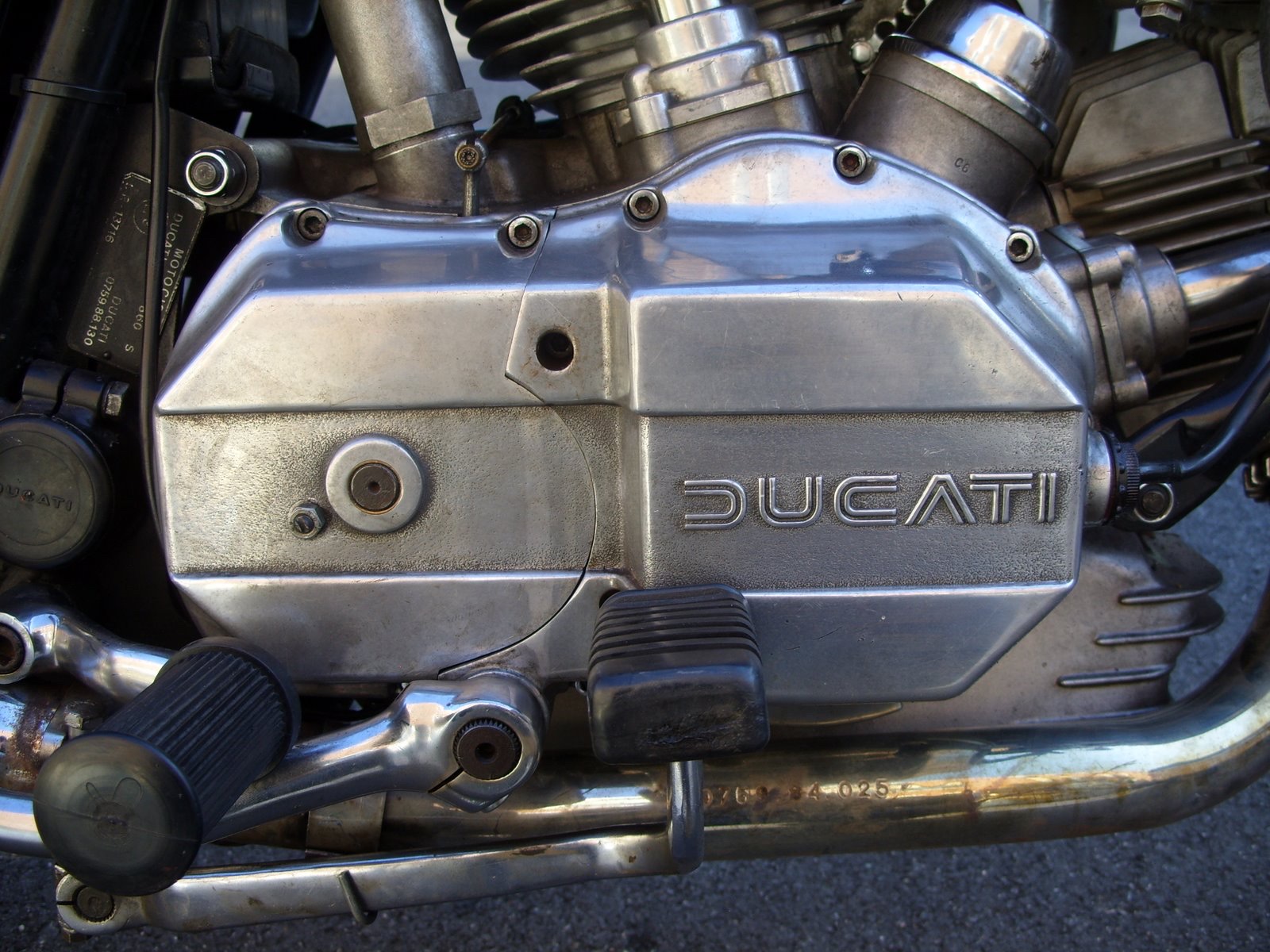 The squared-off right-hand engine case of a 1975 Ducati 860 GT with DUCATI cast into the cover